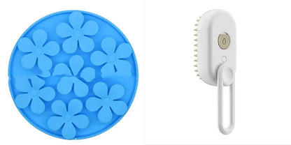 Electric cat steam spray brush with blue flower-patterned comb head and white handle