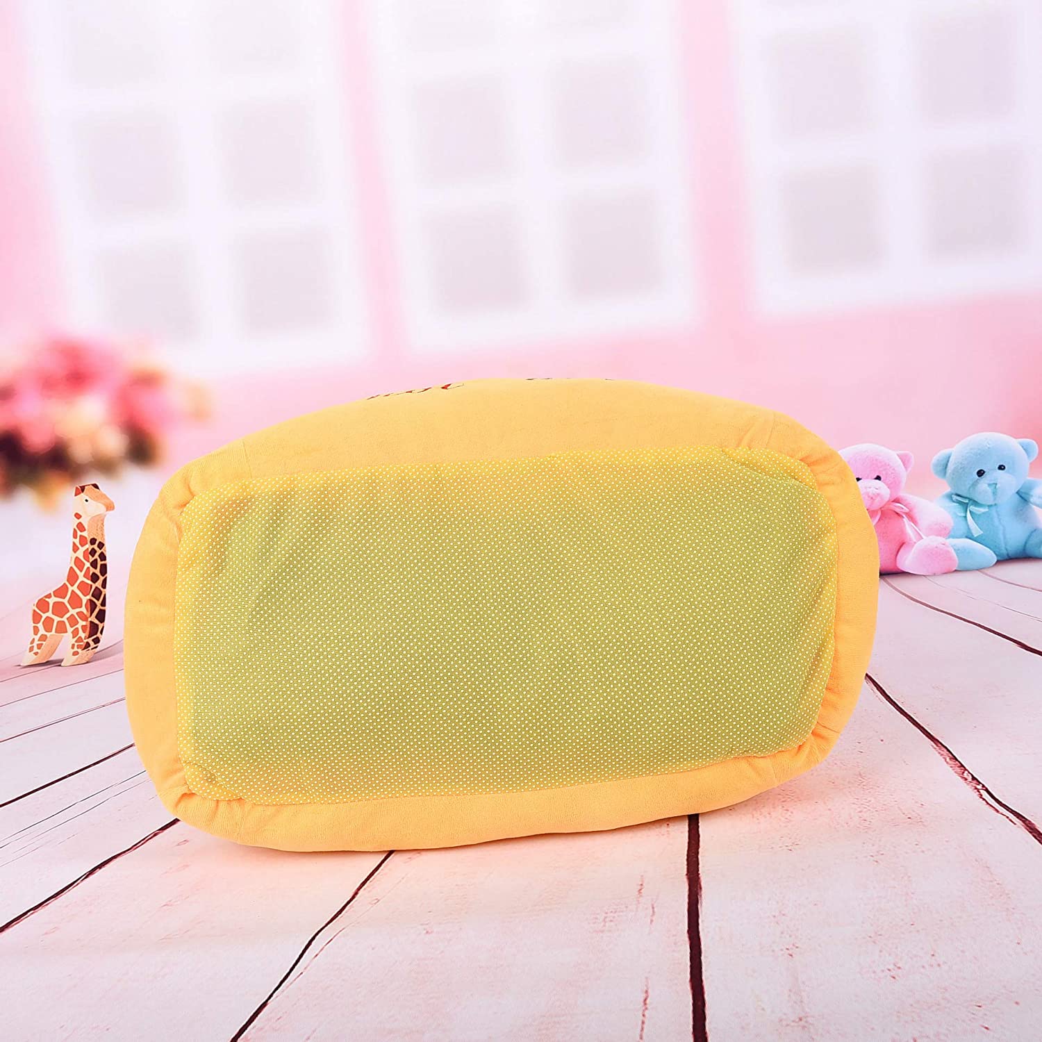 Hot dog-shaped pet bed, orange plush back panel with rounded, padded edges.