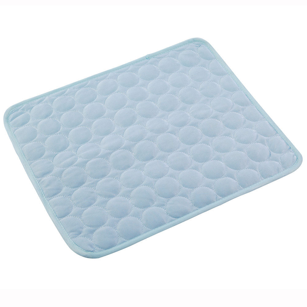 Light blue cooling pet mat with textured honeycomb surface and stitched border