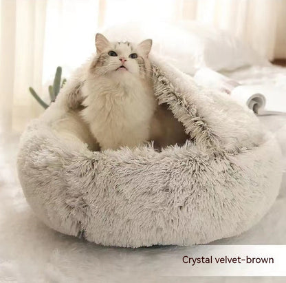 Cozy winter plush pet bed, round brown cave bed with thick fuzzy sides and open interior.