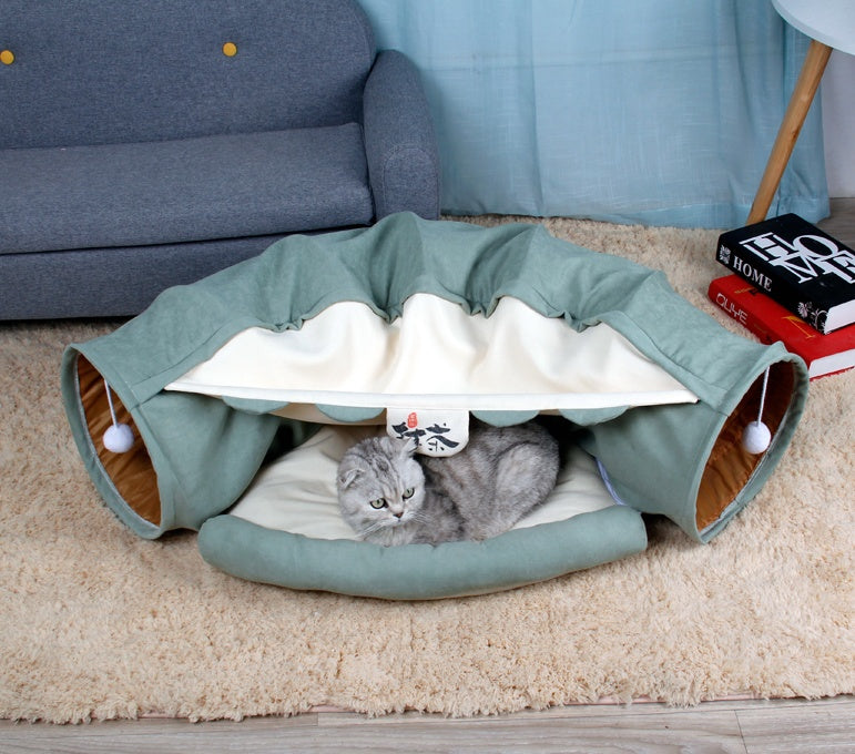 Sage green collapsible cat tunnel play bed with white-striped lining and padded cushion