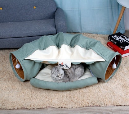 Sage green collapsible cat tunnel play bed with white-striped lining and padded cushion