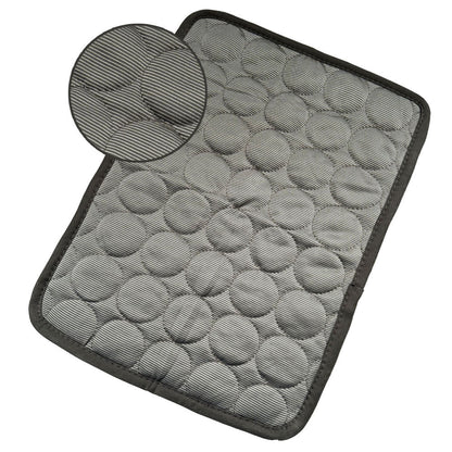 Dark gray cooling pet mat with textured honeycomb surface and black edge trim