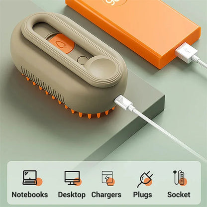 Cat steam brush with beige handle, orange bristle head and USB charging cable
