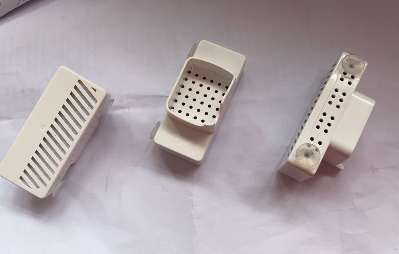Three white water dispenser filter units with grille panels