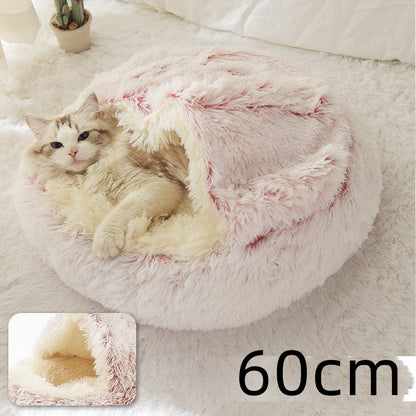 Pink plush round pet bed with curled sleeping area, 60 cm