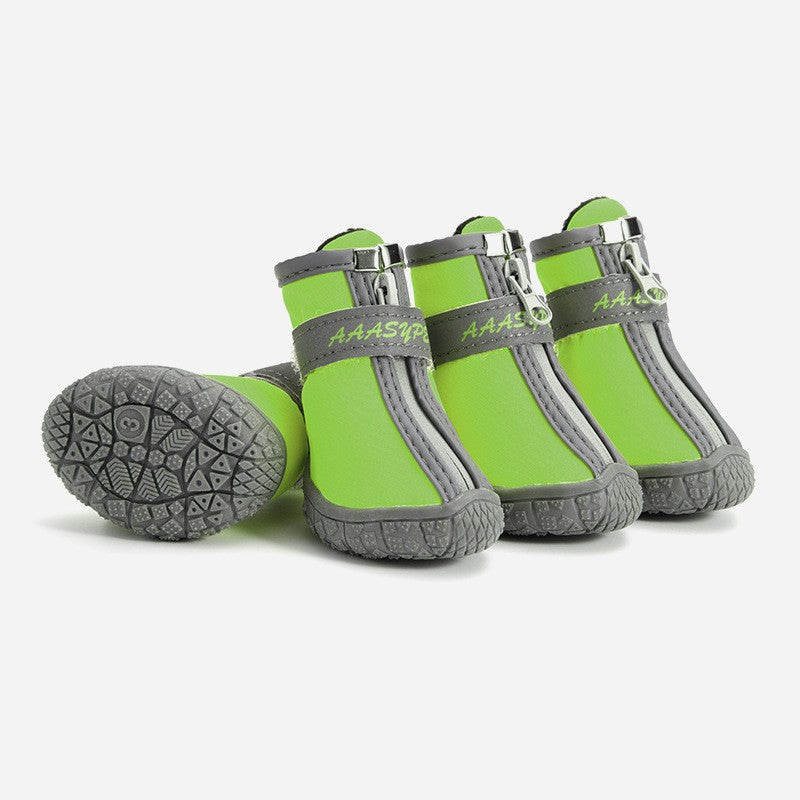 Waterproof pet rain boots, bright green with gray trim and side buckles.