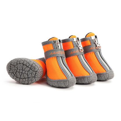 Waterproof pet rain boots, orange with dark gray trim and grippy textured outsole.