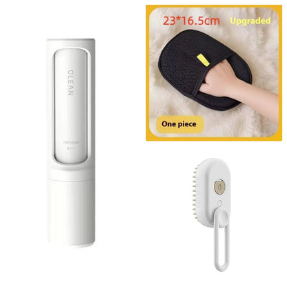 White electric cat steam spray brush with comb head and button, plus black cleansing pad