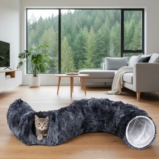 Dark gray plush cat tunnel bed with one visible entrance, cat peeking inside