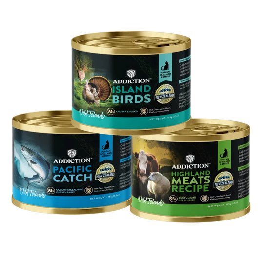 Three ADDlCTION canned cat food varieties bundle, gold-lidded cans on white background