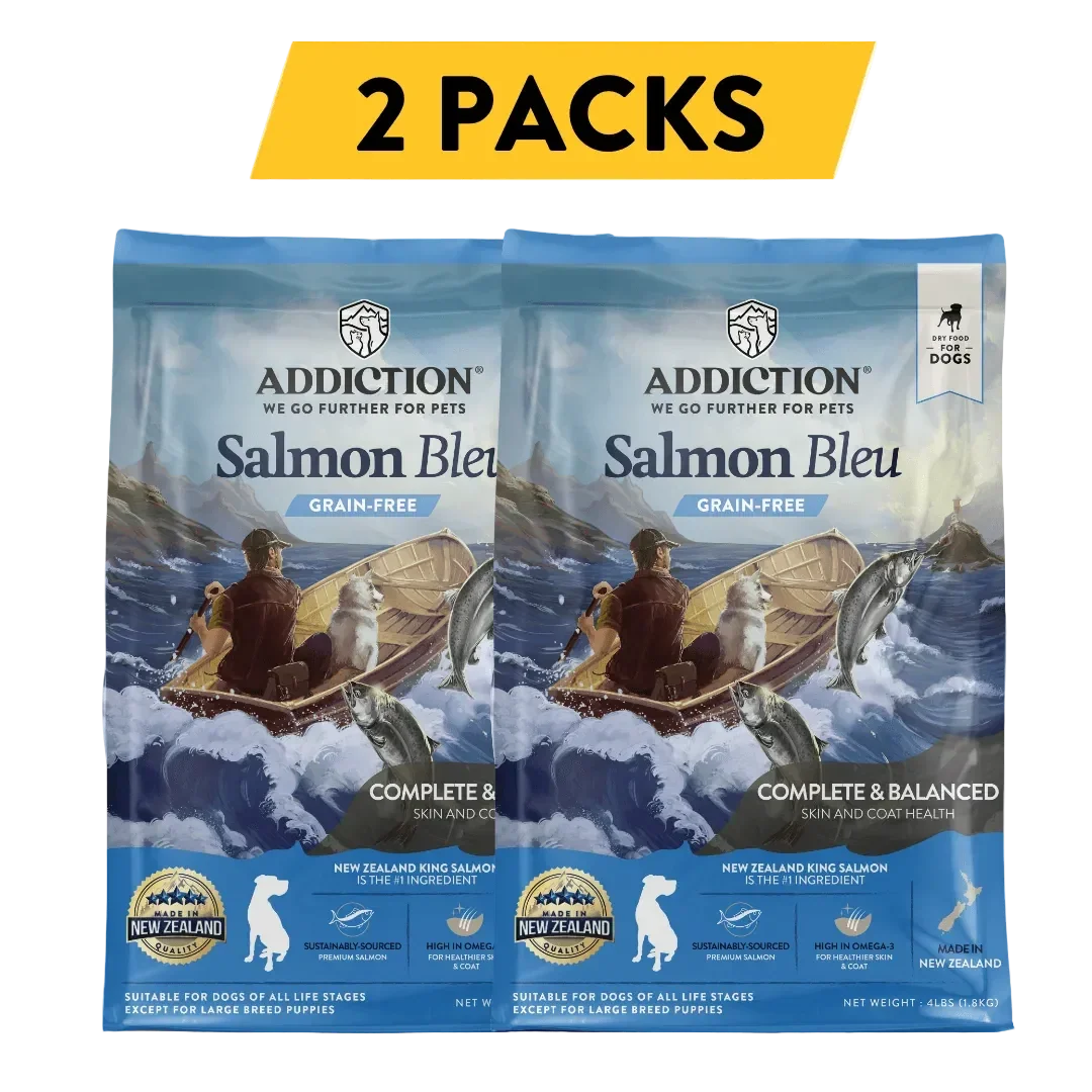 Two packs of Addiction Salmon Bleu grain-free dog food for skin and coat health, made in New Zealand.