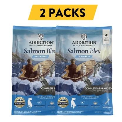 Two packs of Addiction Salmon Bleu grain-free dog food for skin and coat health, made in New Zealand.