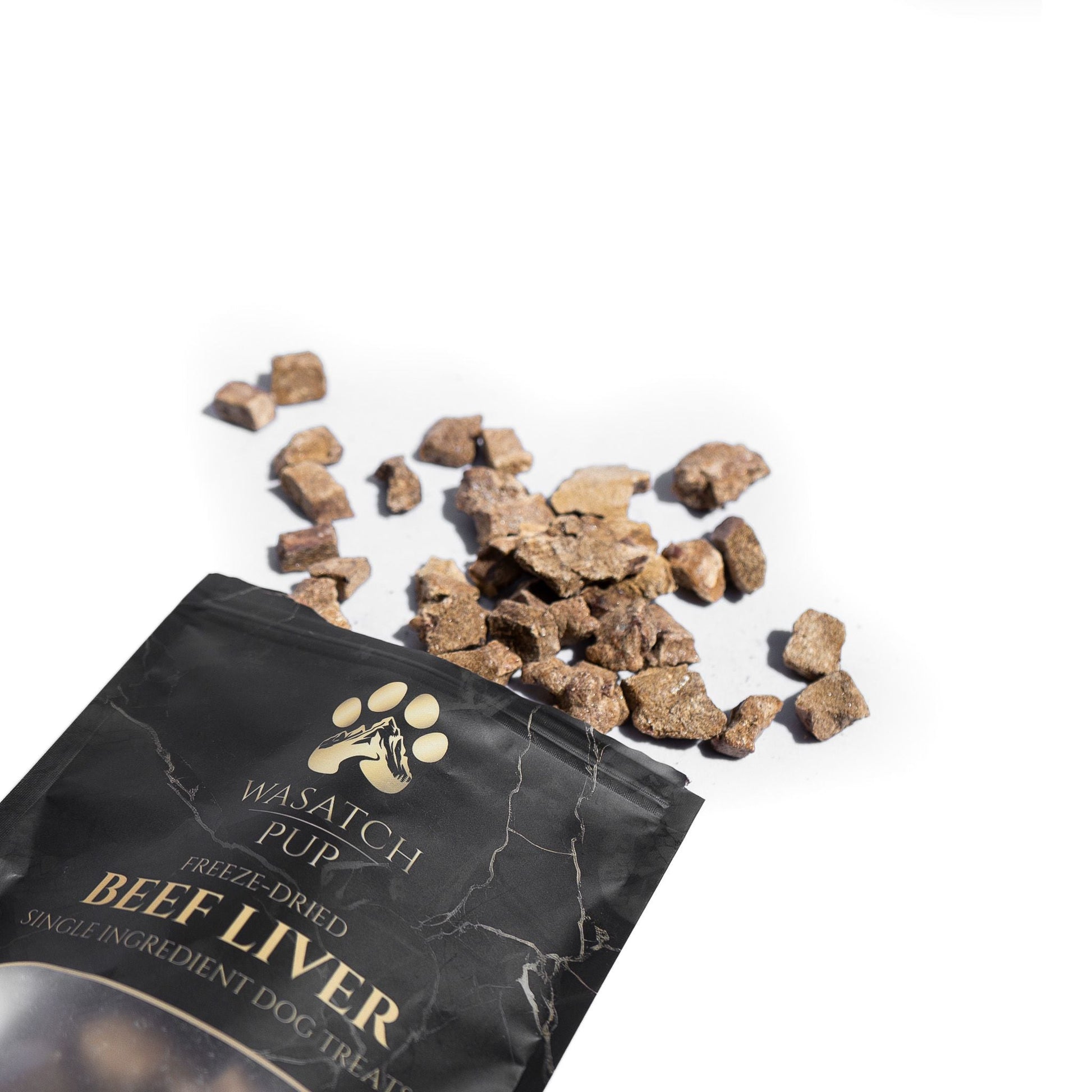 Freeze-dried beef liver dog treats bag with scattered beef liver chunks