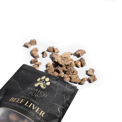 Freeze-dried beef liver dog treats bag with scattered beef liver chunks