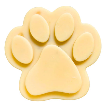 Paw-shaped goat milk soap bar, pale yellow, oval slices
