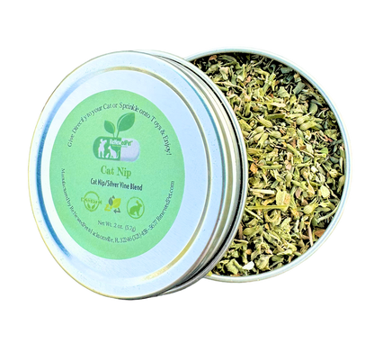 Catnip and silver vine mix metal tin with open lid and pile of dried leaves