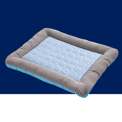 Blue cooling pet mat with light blue dotted surface and striped fabric border.