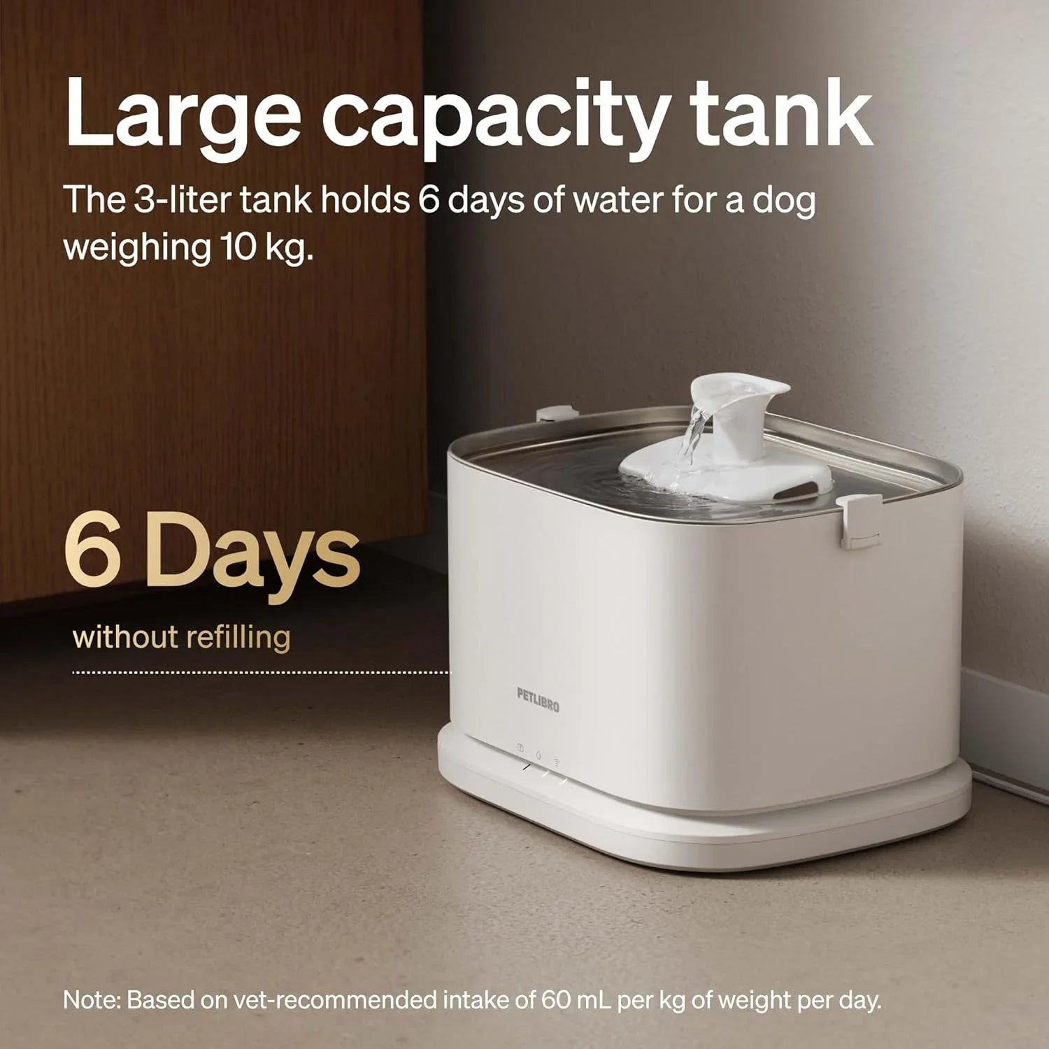 White automatic pet water fountain with water stream from the top reservoir and tray.