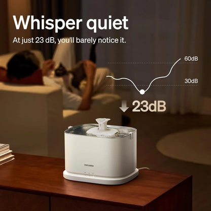 White automatic pet water fountain with running stream from the top nozzle on a base.
