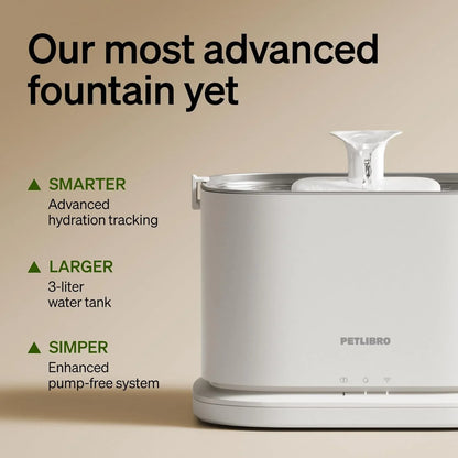 White automatic pet water fountain, top nozzle and stainless bowl on a rounded base.