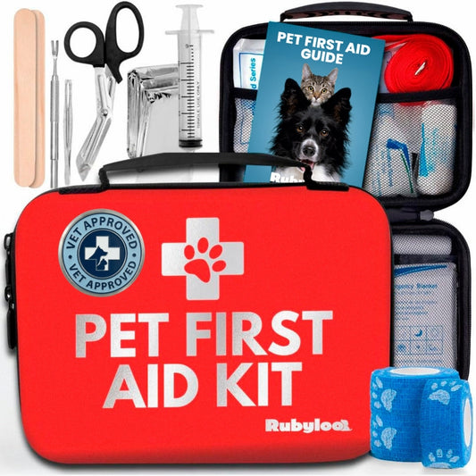 Pet first aid kit case with paw emblem and pet first aid guide, blue bottles