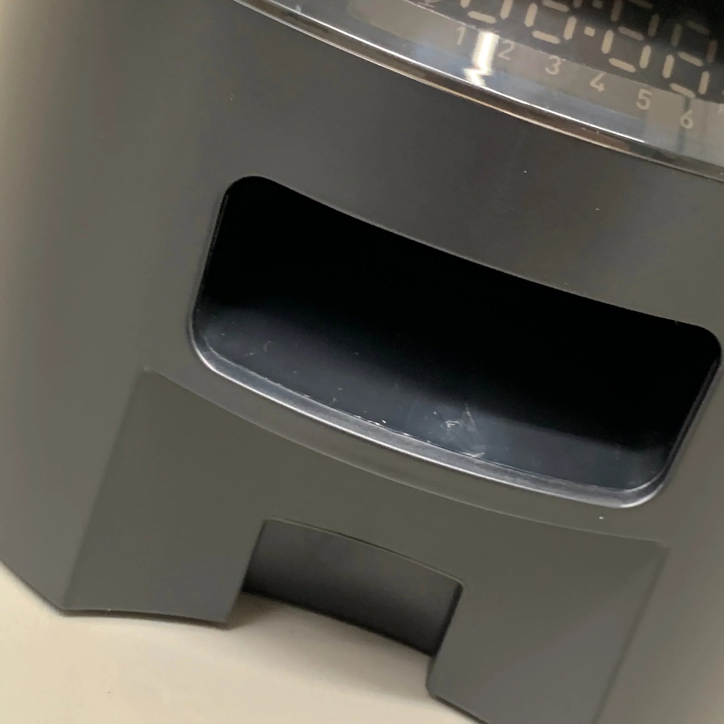 Black feeder tray opening with front support bracket