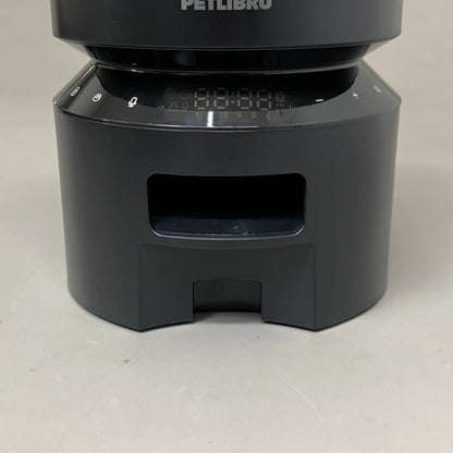 Black automatic feeder base with front access opening and numbered control strip