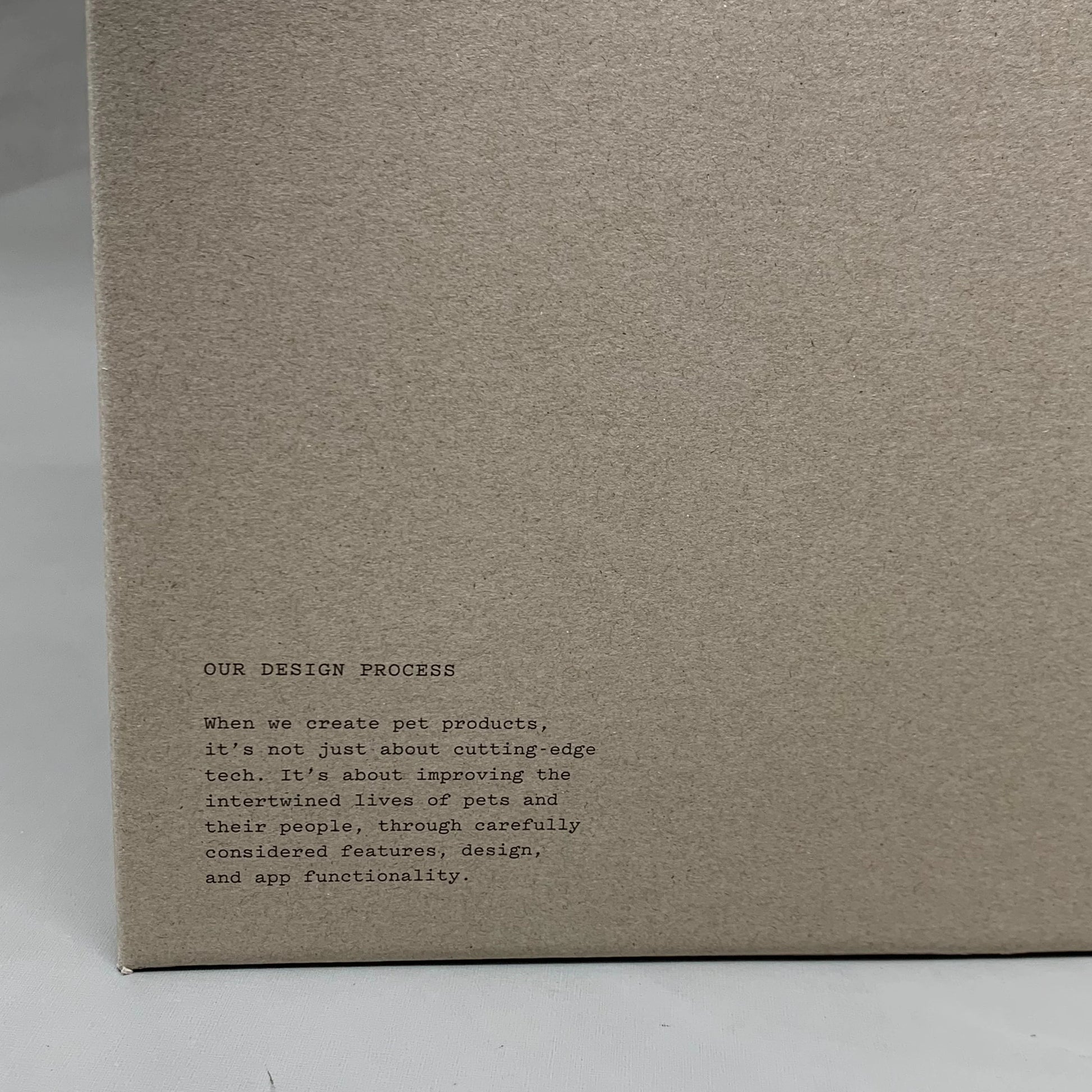 Cardboard product box with small printed text near bottom edge