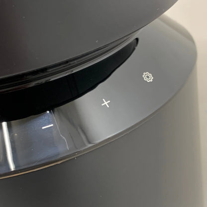Black automatic cat feeder, open lid edge with clear window and control detail