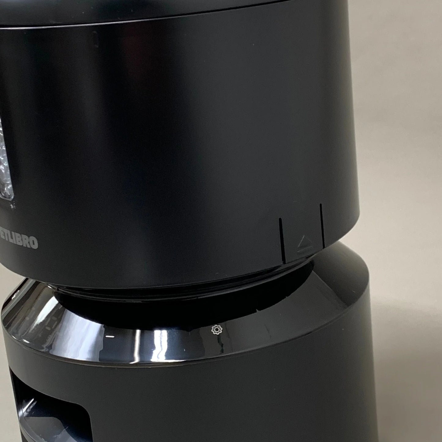 Black automatic cat feeder front view of stacked base and inner tray opening