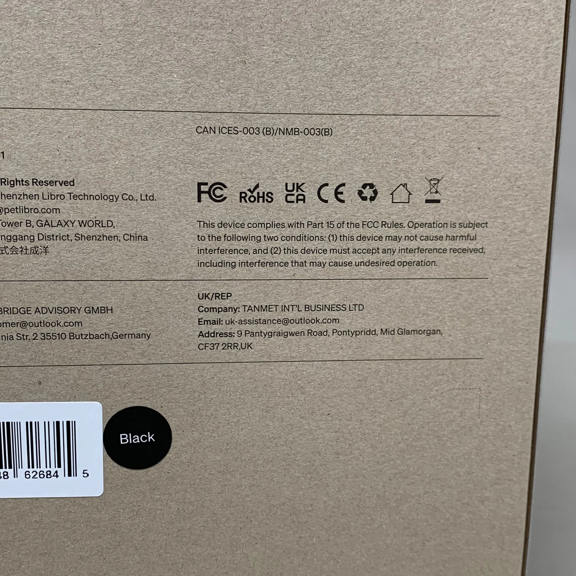 Automatic cat feeder box side with regulatory icons and black