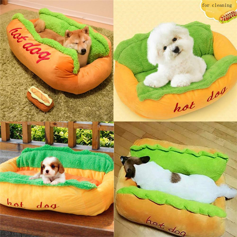 Orange hot dog shaped pet bed with green plush sides and red hot dog text; dogs inside