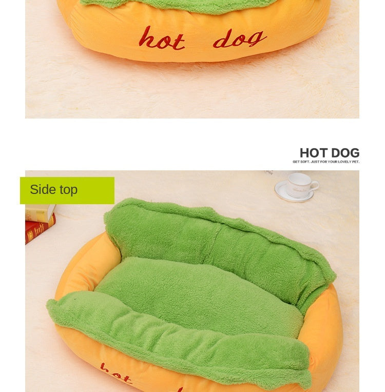 Hot dog-shaped pet bed side view, orange base with green nest pad and red embroidery.