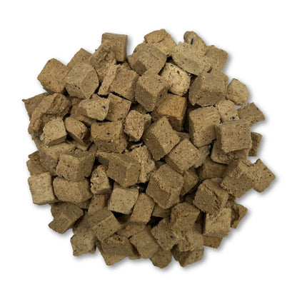 Freeze-dried beef cubes for dog food, small crumbly chunks.