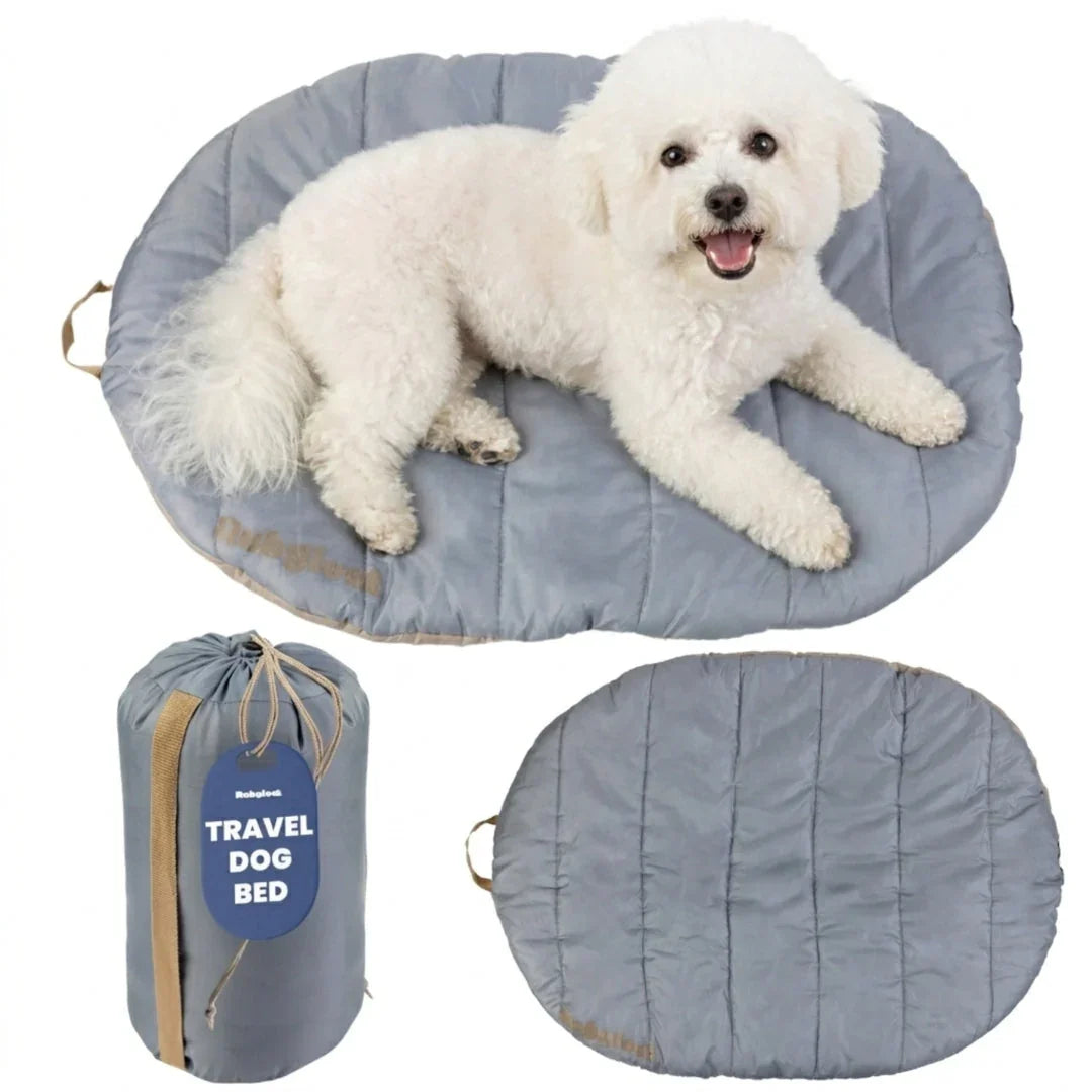 Travel dog bed with light gray quilted oval mat and matching compact carry bag