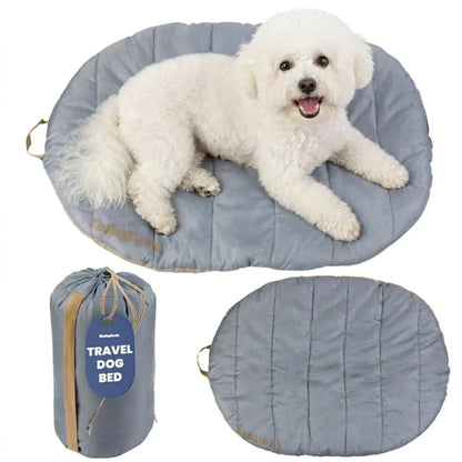 Travel dog bed with light gray quilted oval mat and matching compact carry bag