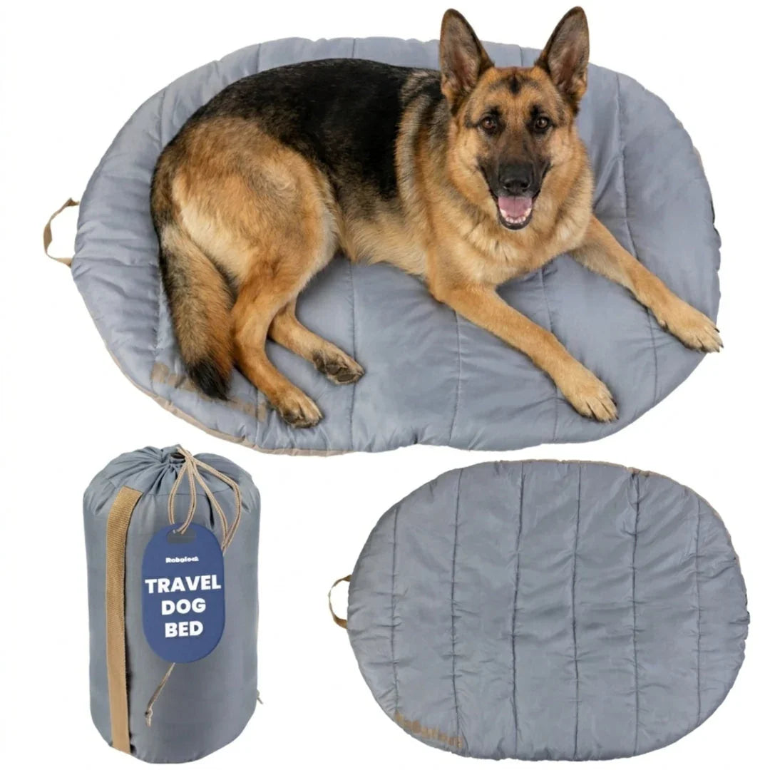 Travel dog bed with gray quilted oval mat and matching compact carry bag