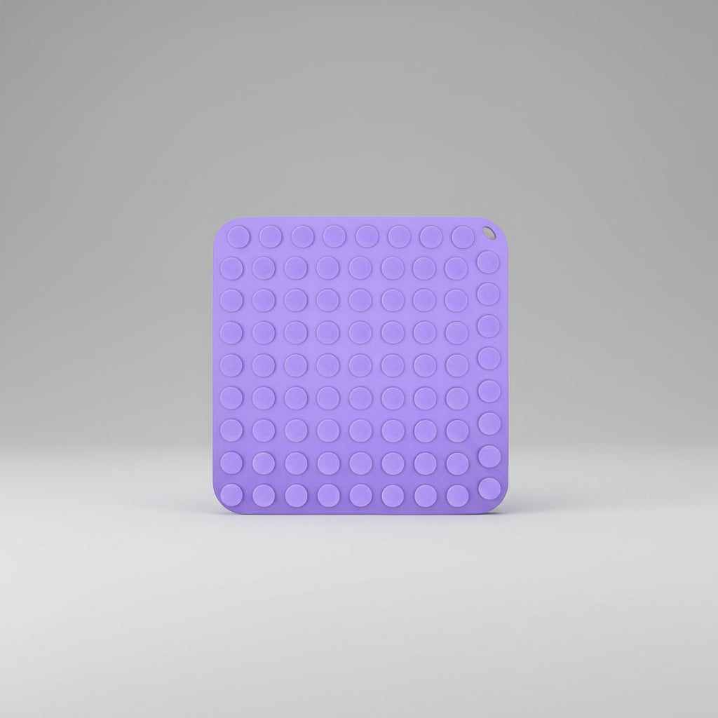 Purple silicone slow feeder lick mat with dotted suction pattern on one side