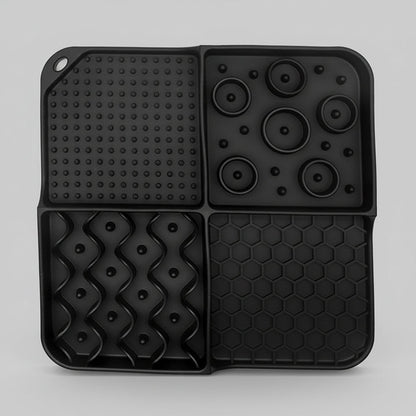 Black silicone slow feeder lick mat with dot panel, paw-disk bumps, and hexagon grid