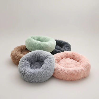 Four Midfox Plush Donut Comfort Pet Beds in mint green, grey, pink, and brown colors.