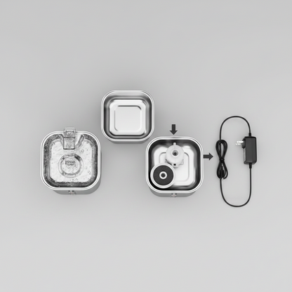 Pet water fountain components: pump housing, water tray, USB adapter and cable