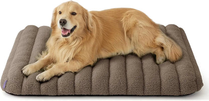 Orthopedic dog bed in dark brown/grey plush with a golden dog lying down