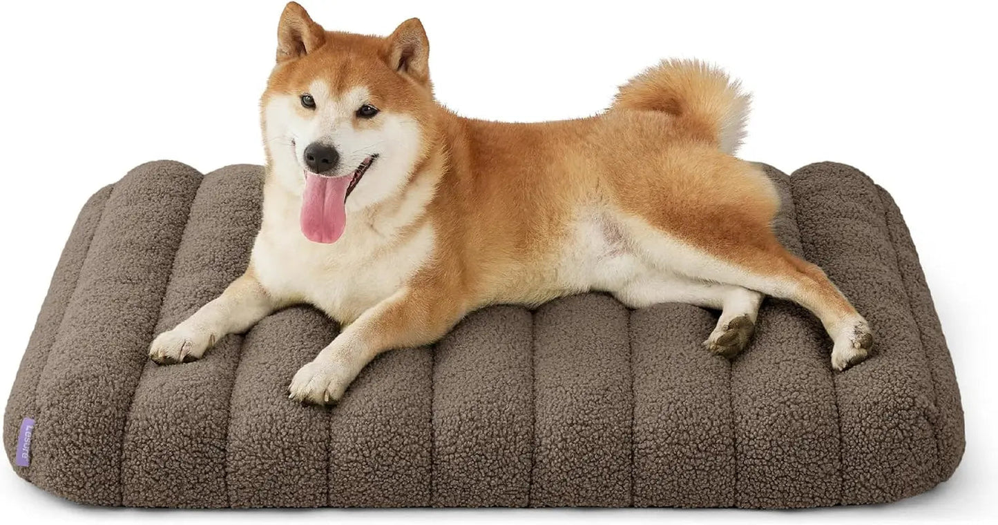 Orthopedic dog bed, dark gray plush with curved side bolsters and quilted center