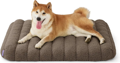 Orthopedic dog bed, dark gray plush with curved side bolsters and quilted center