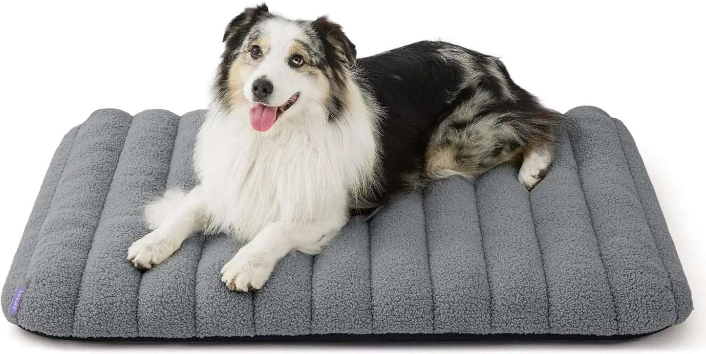 Orthopedic dog bed, medium gray plush with curved bolsters and quilted ridges