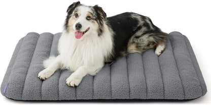 Orthopedic dog bed, medium gray plush with curved bolsters and quilted ridges