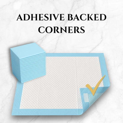 Light blue puppy pee pad with adhesive-backed corners shown