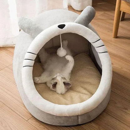 Gray and white plush cat cave bed with ear top and striped side panels