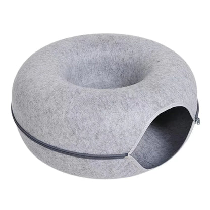 Gray felt donut cat bed with cozy cave entrance, perfect for napping pets